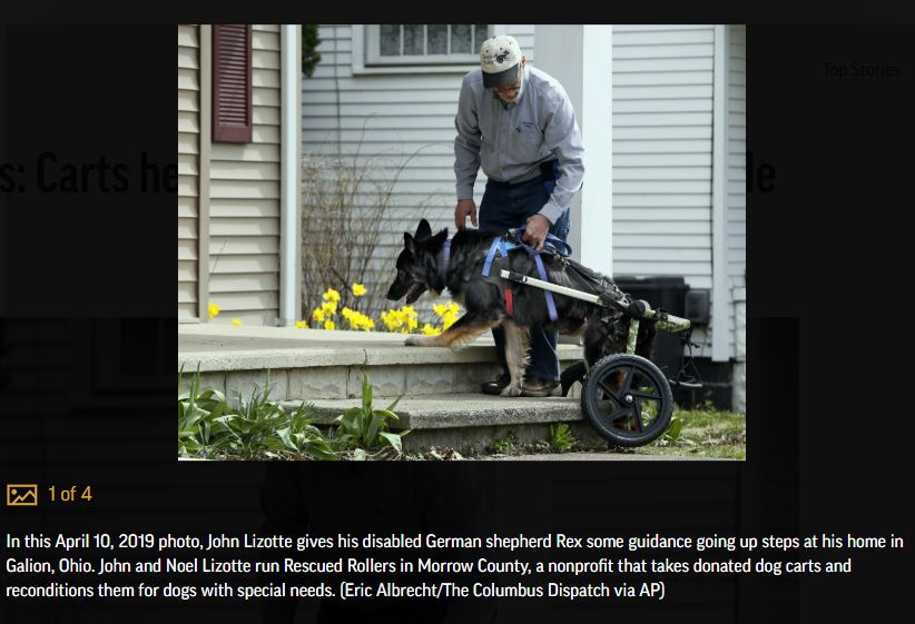 Rescued Rollers founder, John Lizotte and Rex the German Shepherd Dog in a wheelchair climbing the step to the front porch. 
